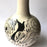 Mexico 1492: The off-white “cántaro” (pitcher), hand made out of clay, hand painted with jewels of the Michoacan nature,  and burnished to shine. Accompanied by a matching glass. Used for storing liquids, like water or wine.   “Cántaro” is a precious piece in every Mexican home, and a favorite way to store water. It is believed that water stays cool in a “cántaro” even on a hottest day.