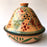 Mexico 1492: What happens when a traditional Morroccan clay dish gets transformed by warm, colorful, unstoppable Mexican creativity? Don Abel y doña Matea created a cultural fusion of Mexico and North Africa, so beautiful and imaginative. Traditional tajine, the predecessor of the modern crock pot, embellished by the talent and skill of the amazing Oaxacan artisans.  Handmade, painted and lead-free glazed in Oaxaca, Mexico.  Version: Grapevine.