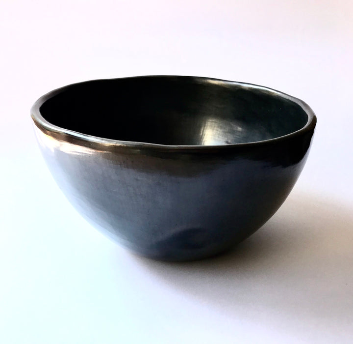 This impressive, handmade, black clay salad bowl from Oaxaca will always be a conversation piece at your dinner. Smooth, shiny black finish. 