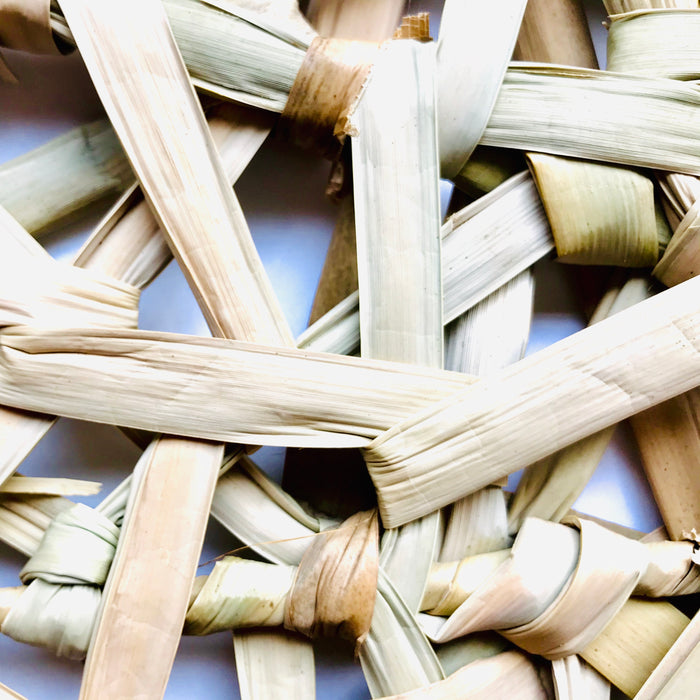 Mexico 1492 - Bulrush fiber, woven as a web on a square metalic frame. A placemat that is beautiful to look at and feels soothing under the fingertips. 