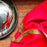 Mexico 1492 - bright red table cloth with colorful edges, handmade on a backstrap loom in Chiapas Mexico. Paired with Black Clay plate from the same shop. 